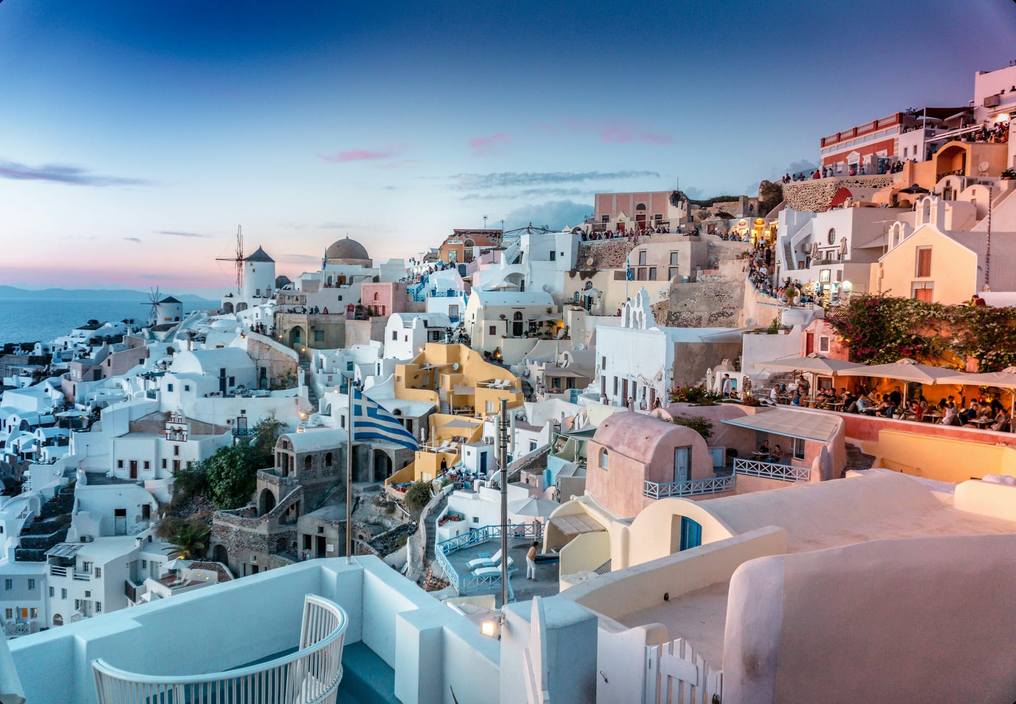 Whitewashed village of Oia in Santorini at sunset