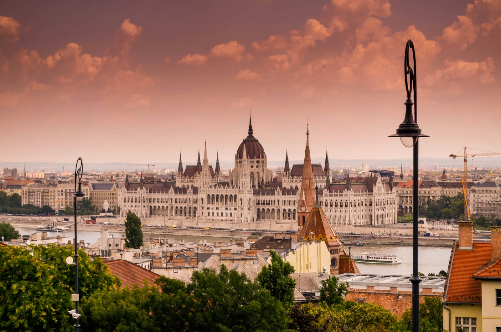 Hungarian Parliament on the Danube embankment at sunset